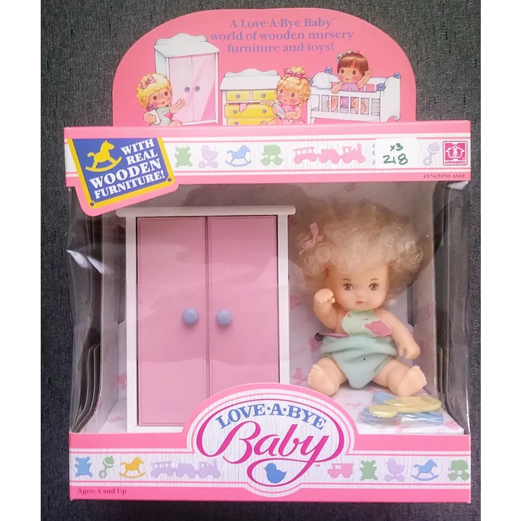 Vintage 1987 Love-a-bye Baby Doll in original packaging with pastel pink wardrobe
