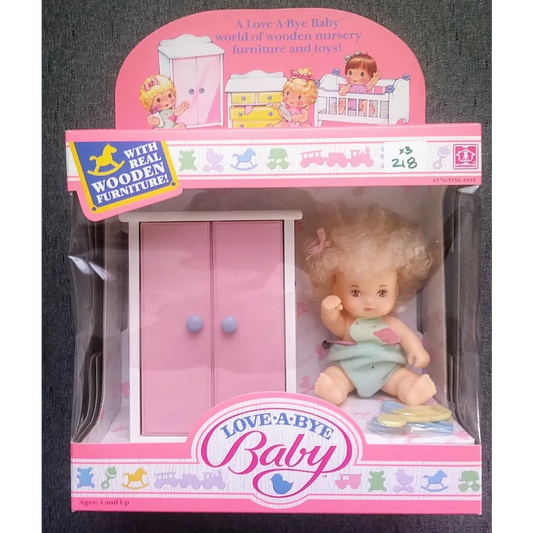 Vintage 1987 Love-a-bye Baby Doll in original packaging with pastel pink wardrobe