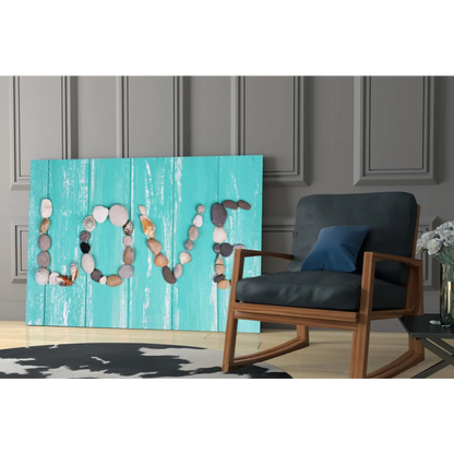 Turquoise wood canvas wall art with love spelled in smooth stones