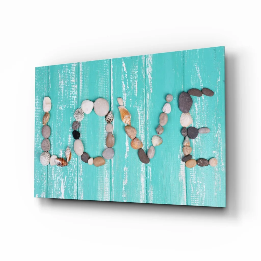 Turquoise wood canvas wall art with love spelled in stones and seashells