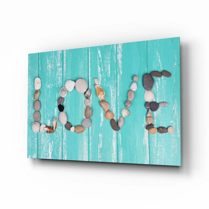 Turquoise wood canvas wall art with love spelled in stones and seashells