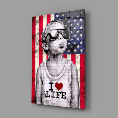 Patriotic boy in sunglasses with I love life shirt on distressed American flag canvas wall art