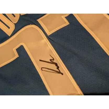 Blue Luka Doncic autographed jersey with white number 7 and signature, perfect for fans