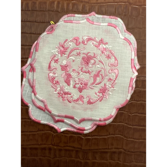 White linen napkin set with pink floral embroidery and scalloped striped border in Luxe Home Collection