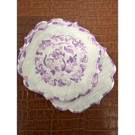 Two white embroidery linen napkins with purple floral embroidery and checkered borders for luxe home collection