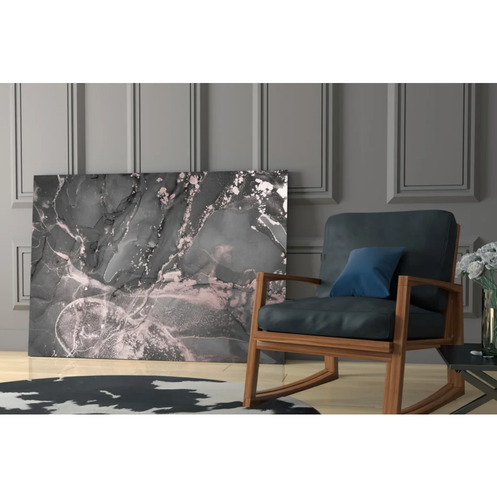 Dark blue rocking chair with wooden frame, navy pillow, under Luxe Rose Gold Marble wall art