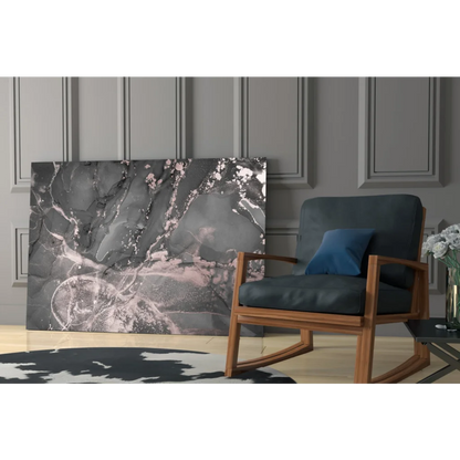 Dark blue rocking chair with wooden frame, navy pillow, under Luxe Rose Gold Marble wall art