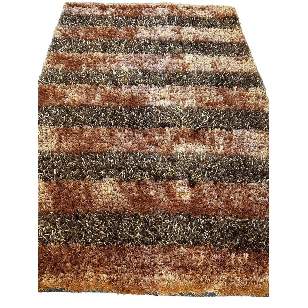 Shaggy striped wool rug in earthy browns, tans and grays with high pile texture