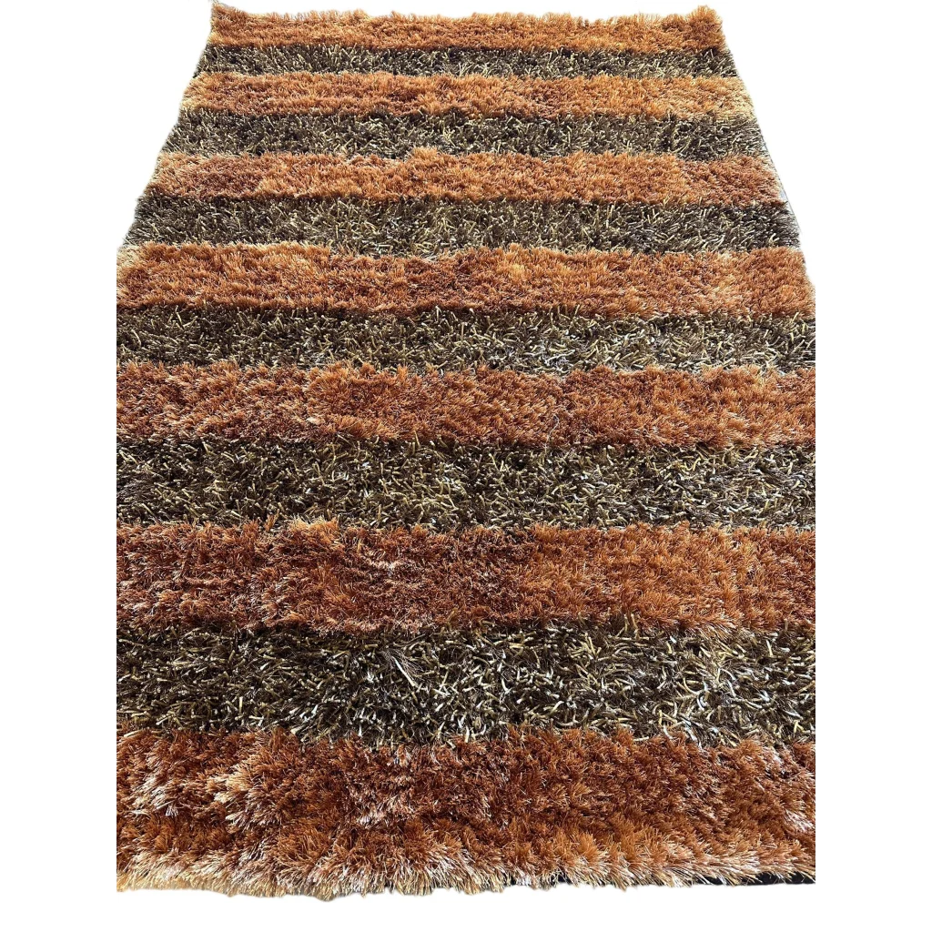 Shaggy striped wool rug in earthy brown and gray tones with plush high pile