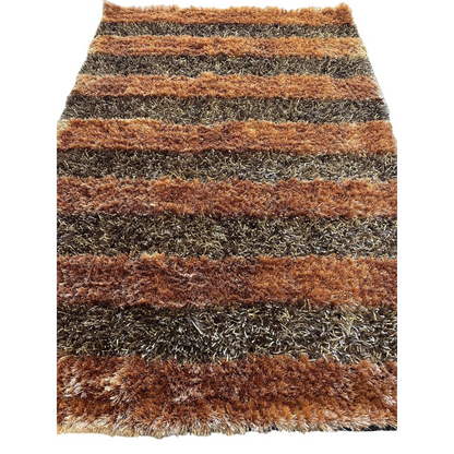 Shaggy striped wool rug in earthy brown and gray tones with plush high pile