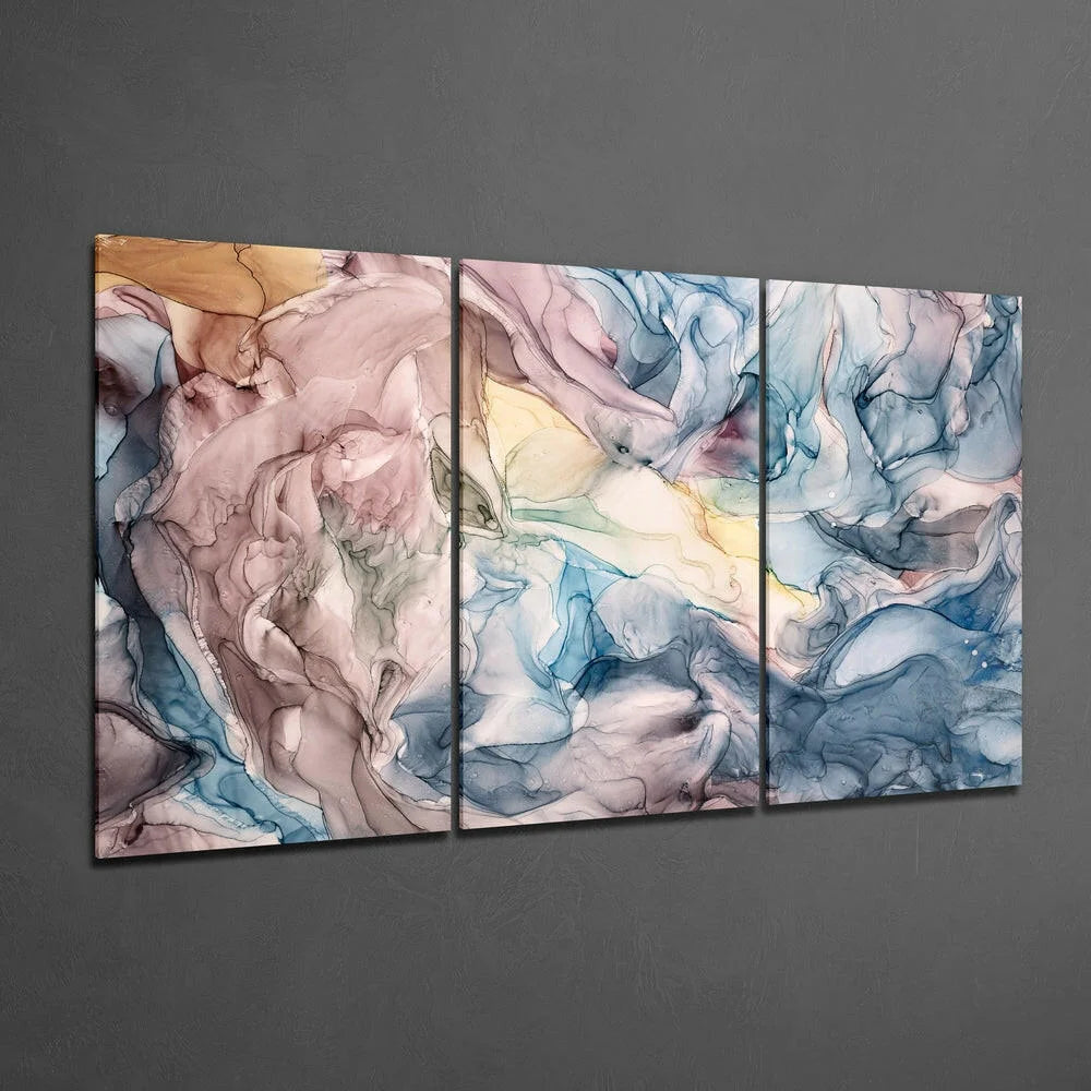 Swirling abstract glass wall art triptych in dreamy pastel blues, mauve, gold