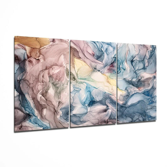 Swirling abstract glass wall art triptych in dreamy pastel blues, mauve, and gold