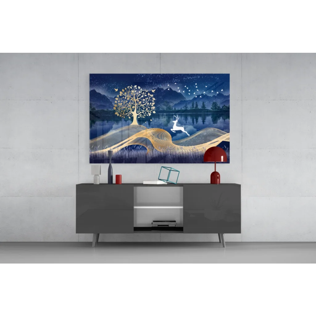 Serene blue and gold glass wall art with glowing tree, leaping deer, and birds over reflective water
