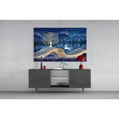 Serene blue and gold glass wall art with glowing tree, leaping deer, and birds over reflective water
