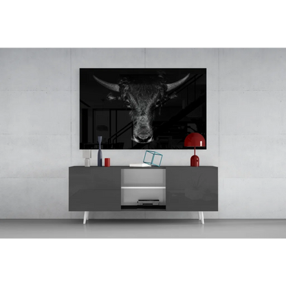 Black and white majestic bull head wall art above gray console