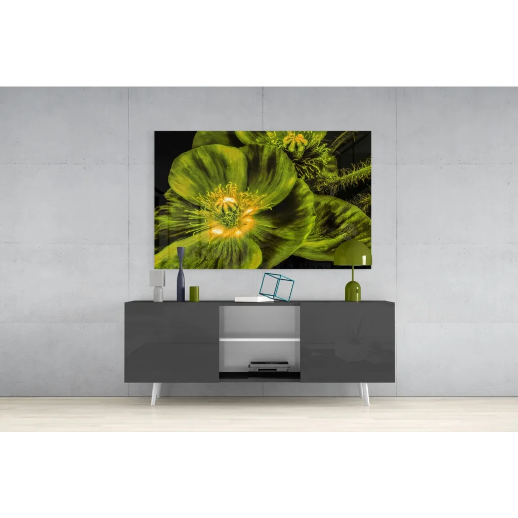 Vibrant green poppy glass wall art with yellow center on gray console