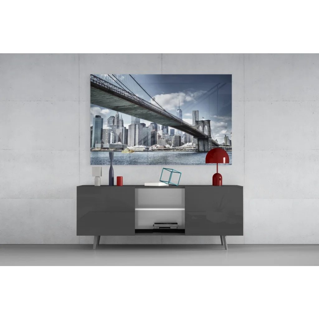 Modern gray console table with red lamp and Brooklyn Bridge wall art