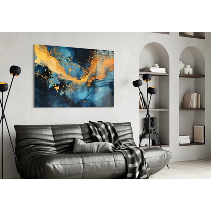 Vibrant blue gold swirl glass wall art canvas over sleek black sofa