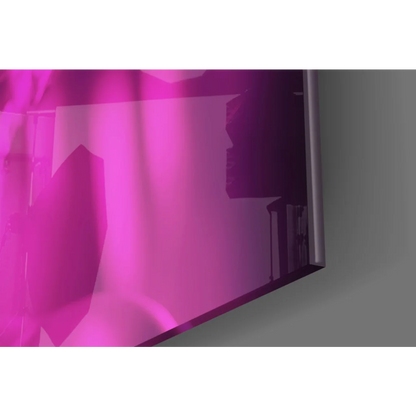 Sleek modern glass wall art print with vibrant pink gradient screen and slim silver bezel