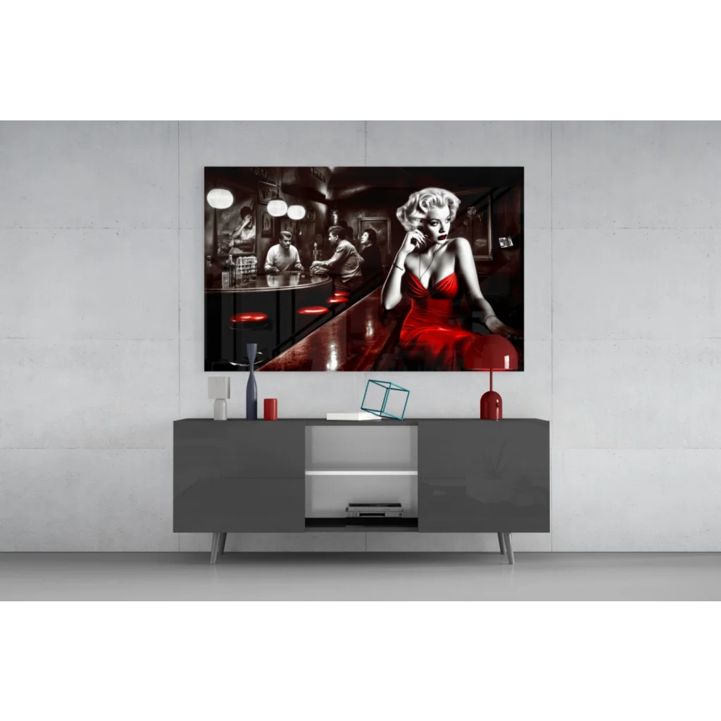 Sleek 4K QLED TV with black frame and silver legs on Marilyn Monroe red dress glass wall art