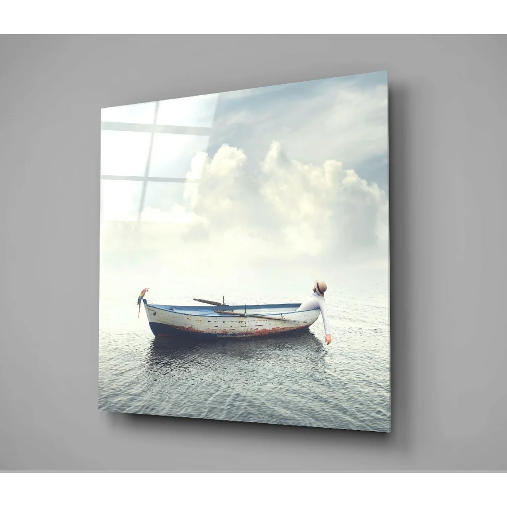 Serene white blue boat glass wall art on calm water under cloudy sky