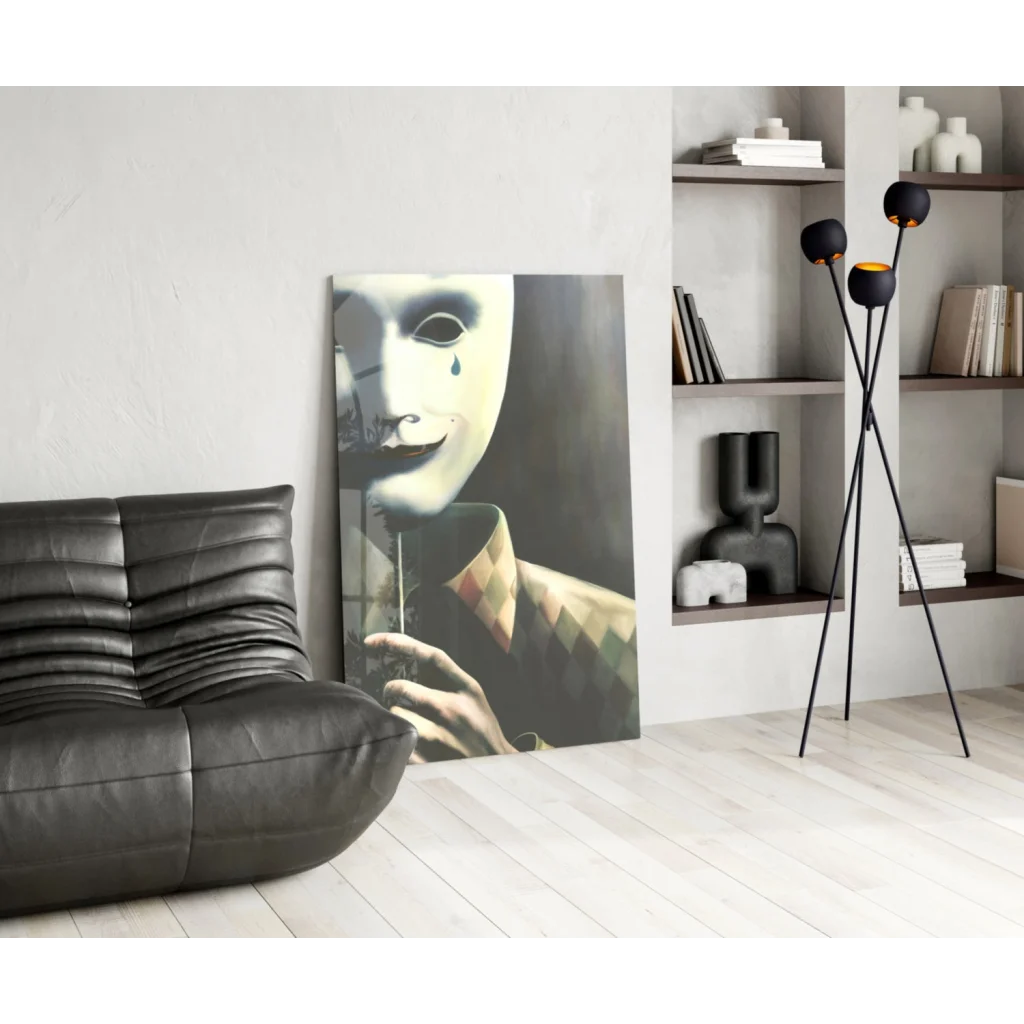 Black leather sofa with ribbed upholstery and tearful mask wall art