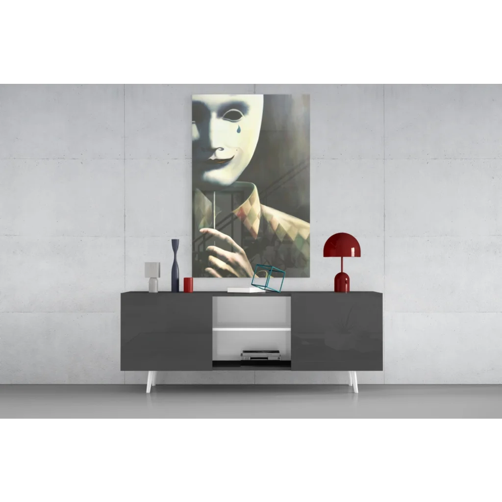 Striking black-and-white masked figure with tear wall art print above gray console