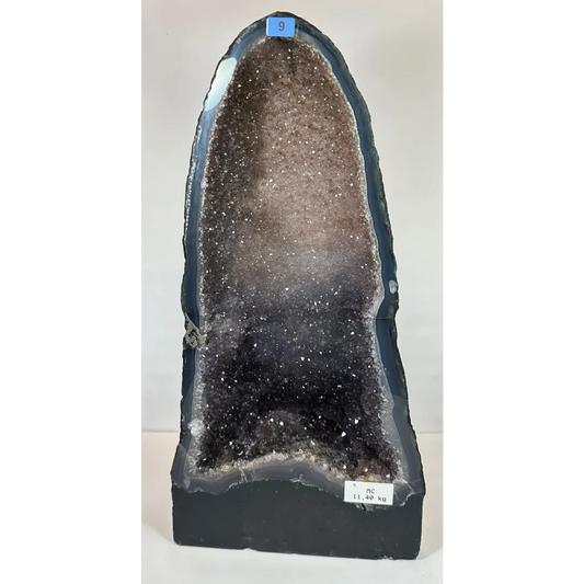 Stunning black and brown amethyst cathedral geode with sparkling quartz crystals