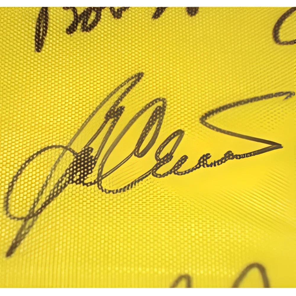 Vibrant yellow Masters Champions pin flag with 16 bold black autographs
