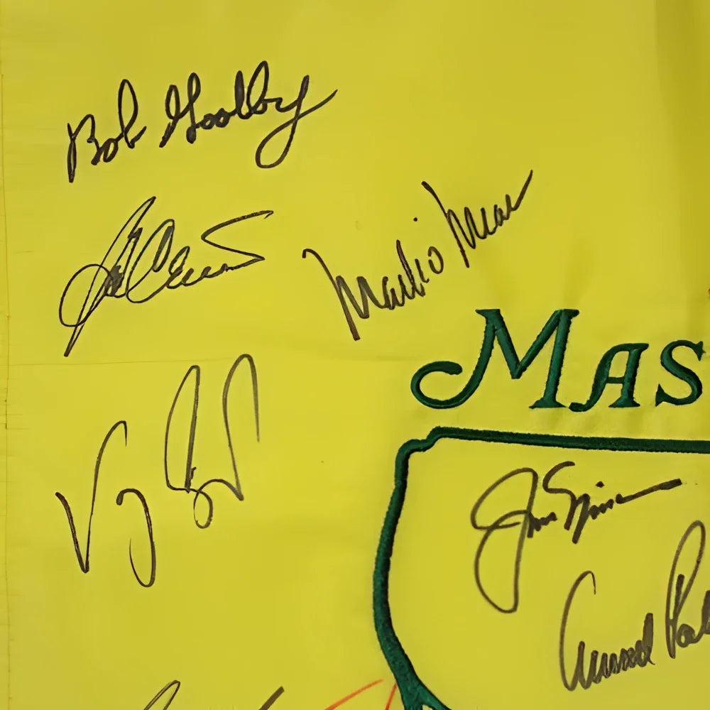 Bright yellow Masters pin flag with green lettering and 16 black signatures