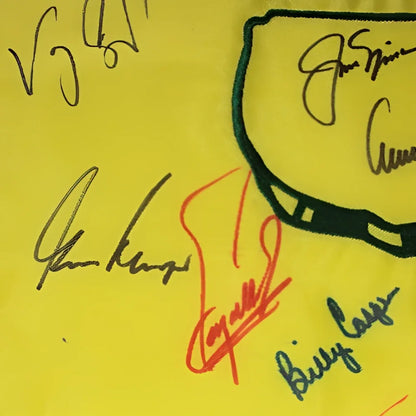 Autographed Masters pin flag with 16 champions signatures on yellow fabric