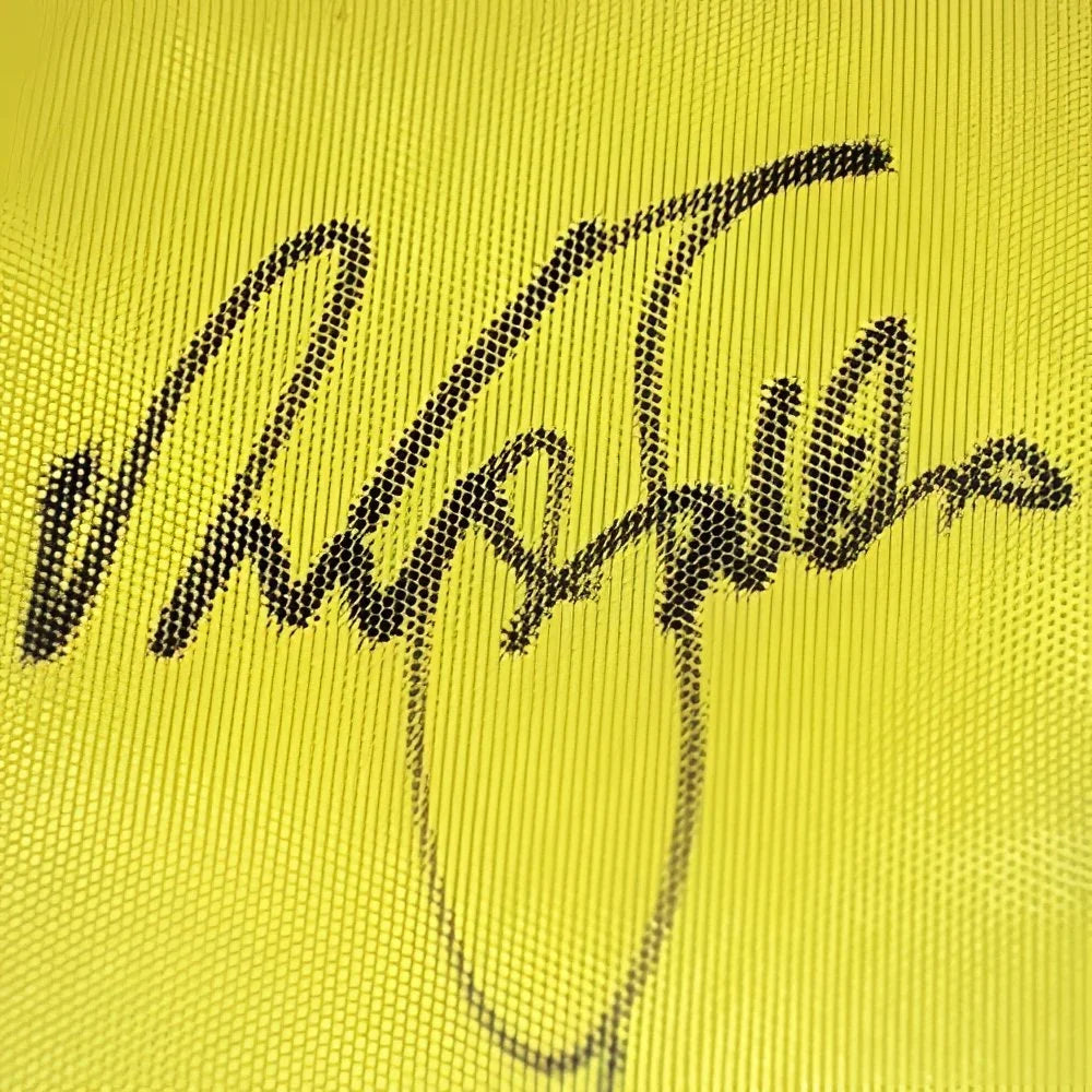 Signed yellow Masters golf pin flag with black signature by 23 champions