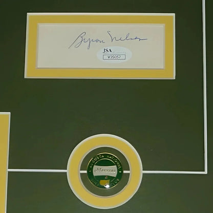 Gold-framed green golf ball with Augusta National logo and JSA authentication in deluxe framed piece