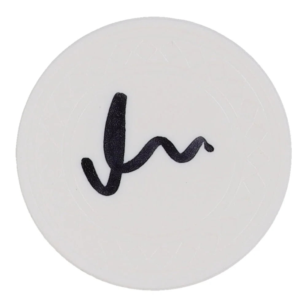 White circular coaster with black wavy line design for Matt Damon signed poker chip