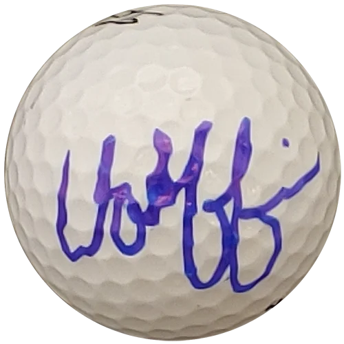 Matthew Wolff autographed golf ball with purple signature on white dimpled surface