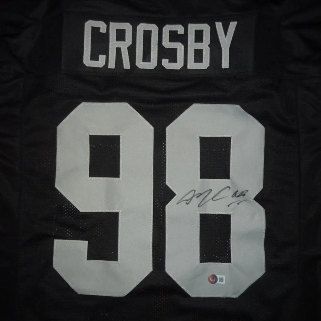 Black Maxx Crosby autographed Las Vegas football jersey with white 98 and signature on the back side numeral