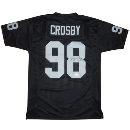 Back of black maxx crosby autographed las vegas football jersey with silver crosby 98 and signature on numeral