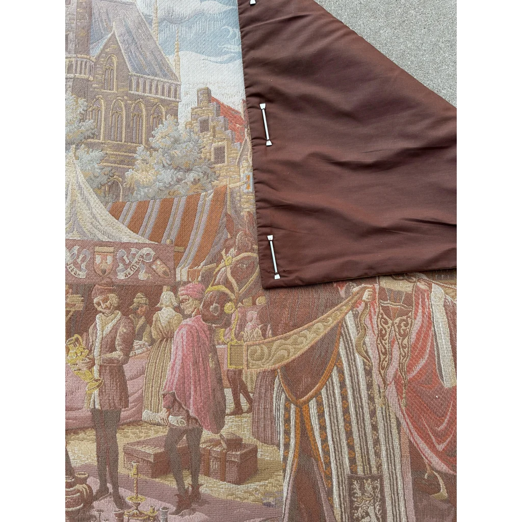 Brown fabric backing with white fasteners on Belgium wall tapestry medieval market scene