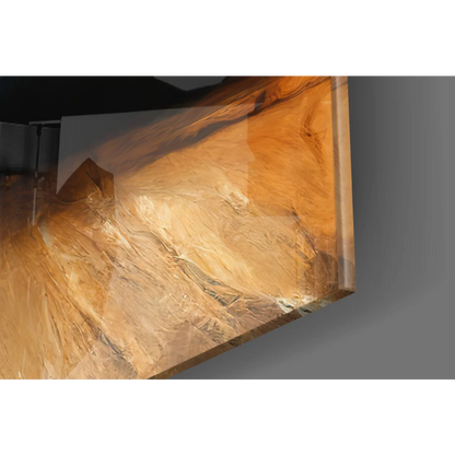 Glowing blue and gold meditation figure glass wall art on sleek amber monitor