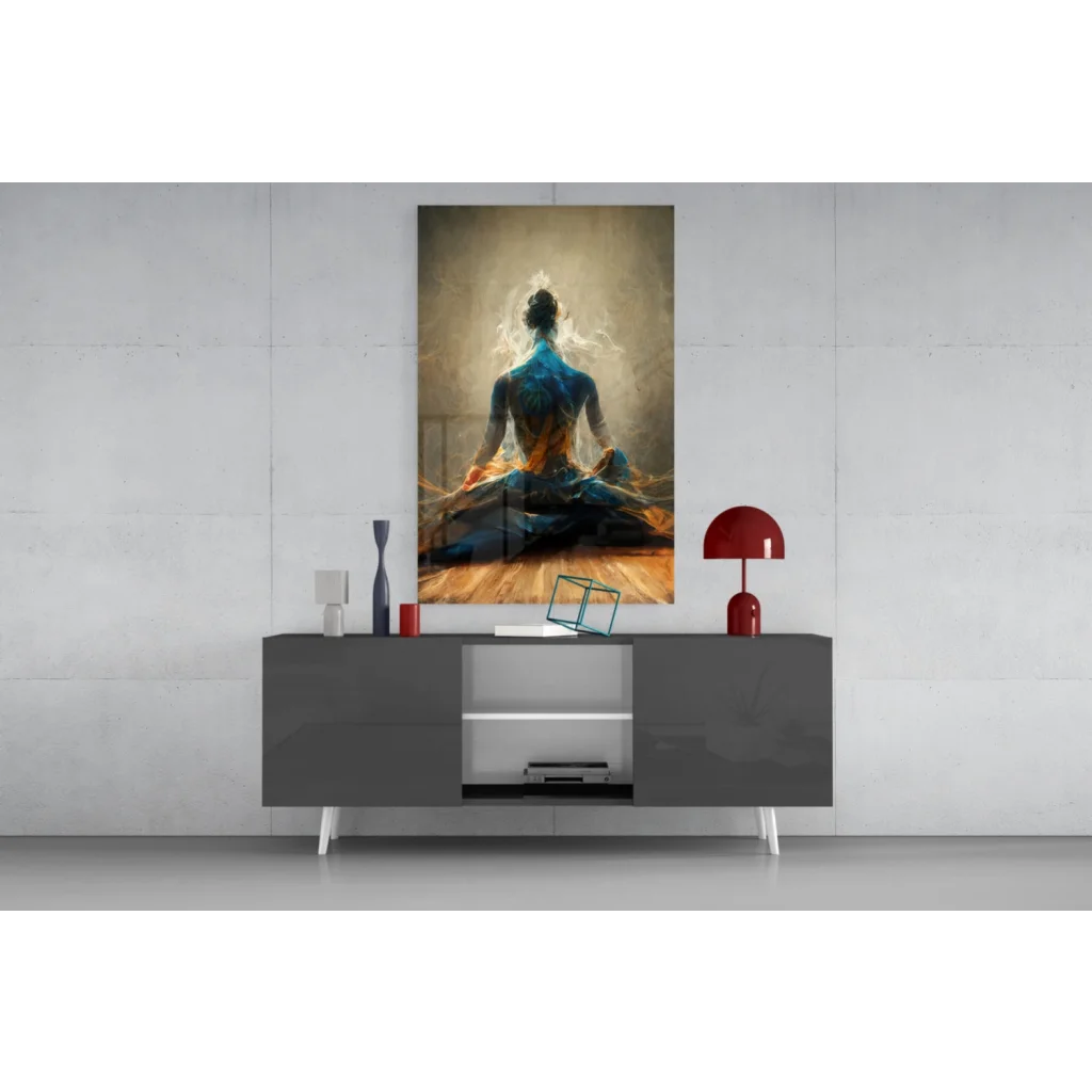 Vibrant blue and gold meditating figure glass wall art on modern console