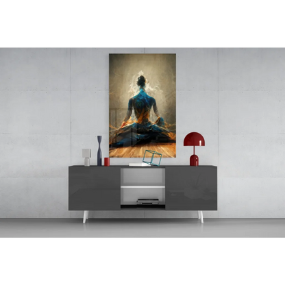 Vibrant blue and gold meditating figure glass wall art on modern console
