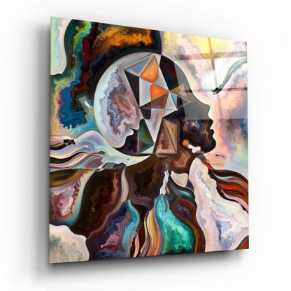 Vibrant abstract glass wall art with swirling face portraits on glossy panel