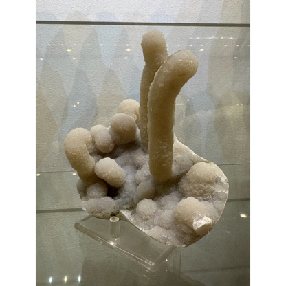 Medium chalcedony stalactite hand geode from India with translucent nodules