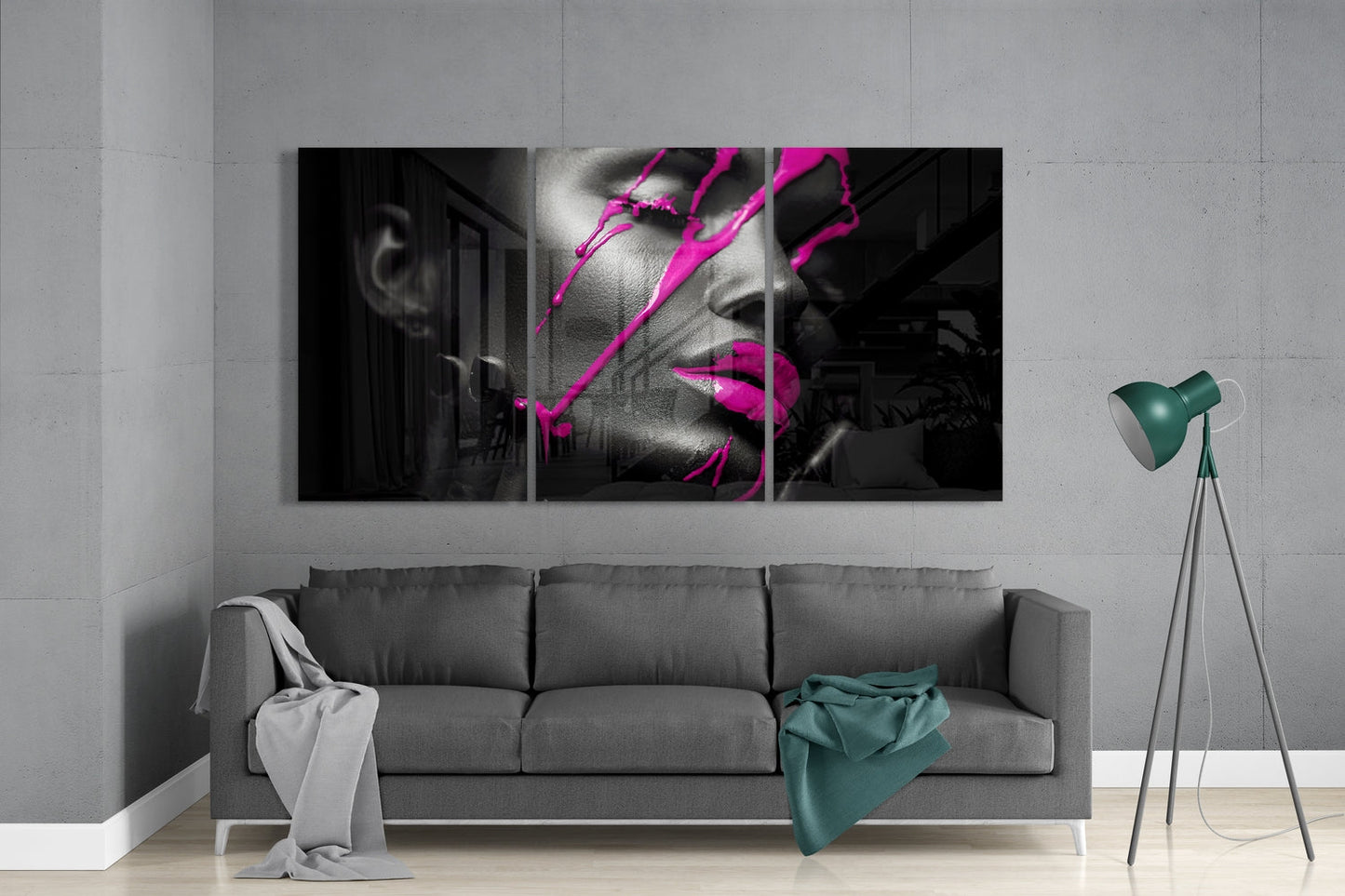 Three-panel glass wall art displaying black and white portrait with bright magenta neon line overlay, installed above gray sofa in modern living room.