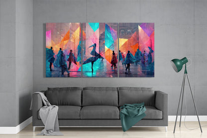 Colorful glass wall art panel displayed above gray sofa in modern living room with tripod lamp and throws.