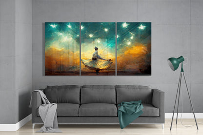 Three-panel glass wall art above gray sofa depicting figure in flowing dress beneath glowing stars and golden-orange sky.