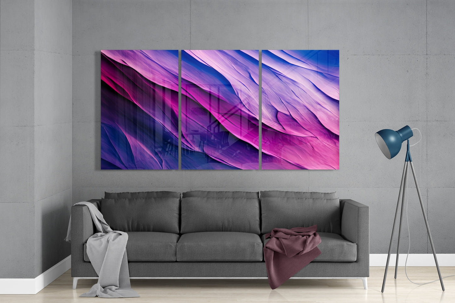 Three-panel purple and blue gradient glass wall art displayed above gray sofa in modern living room interior.
