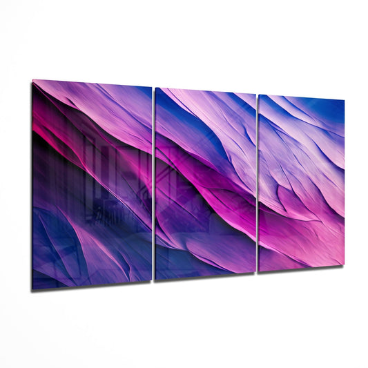 Three-panel purple and blue gradient glass wall art with flowing feather-like patterns displayed at an angle.
