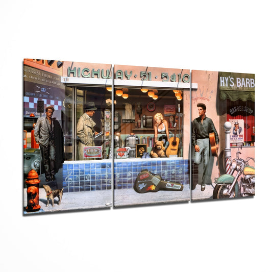 Three-panel glass wall art displaying a retro 1950s street scene with figures, storefronts, motorcycle, and vintage signage on Highway 51.