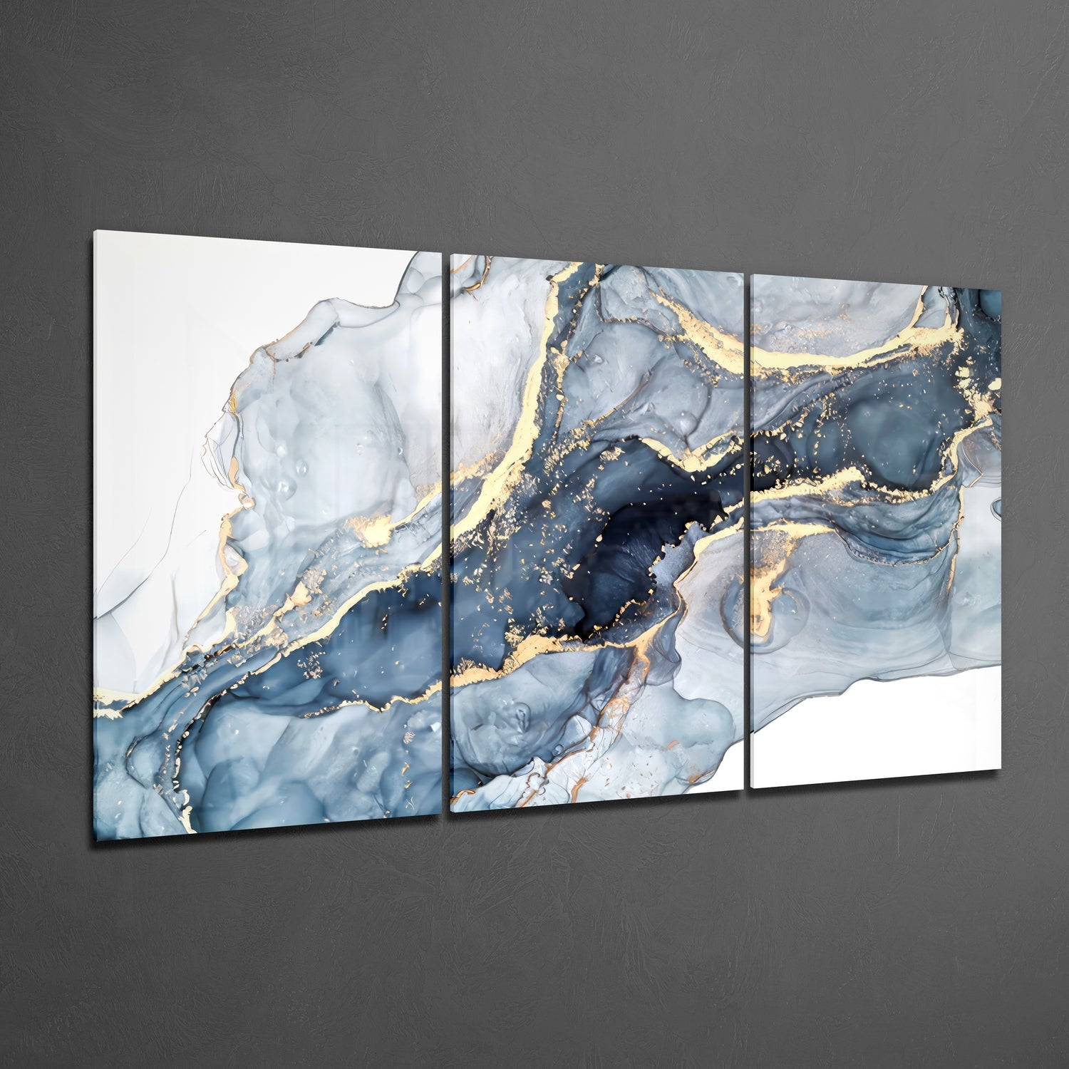 Three-panel glass wall art displaying blue and white marbled abstract design with gold accents, mounted on gray wall at angle.